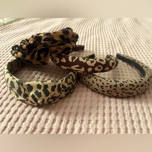 Set of 4 animal print headbands, two are from Madewell. Excellent condition.
